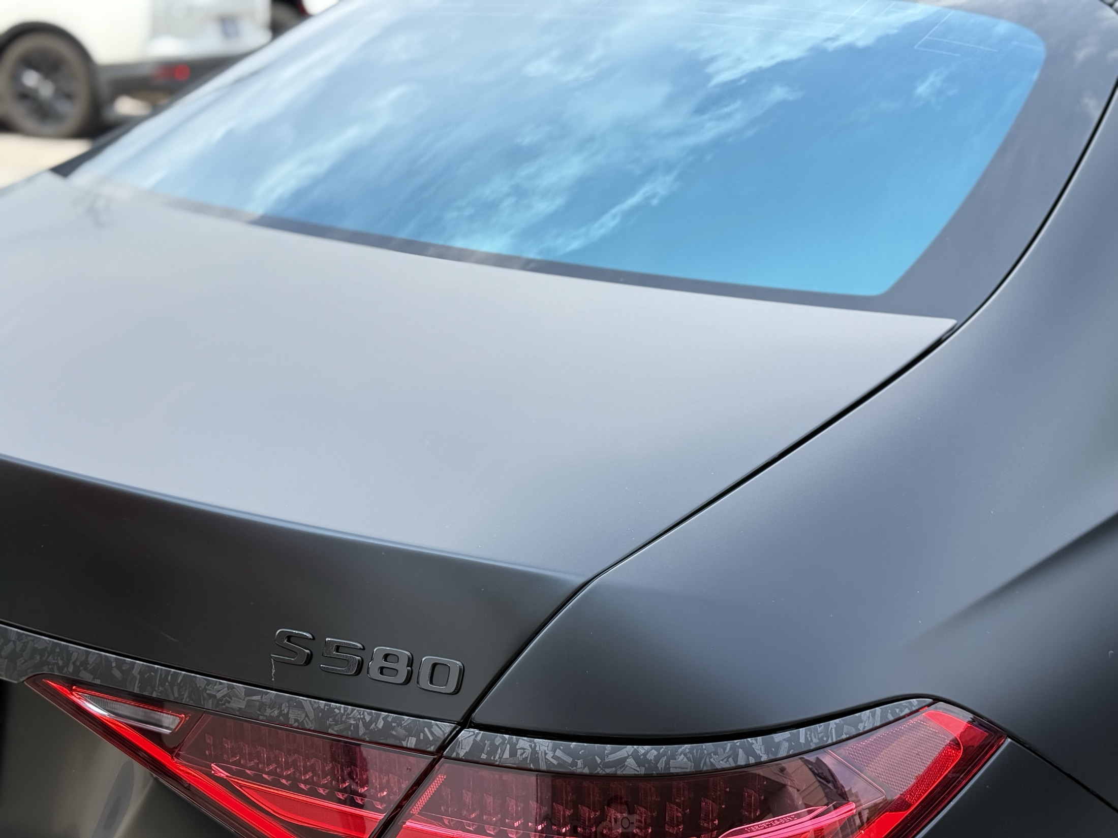 Vehicle rear glass with dark tint